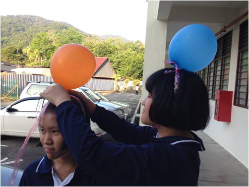 Members are helpful to tie ballon on others friend head